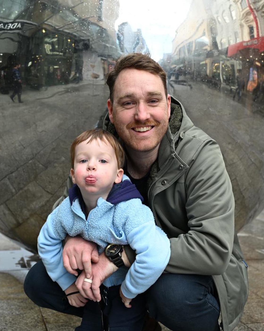 Sam, EEVA's lead videographer, with his son