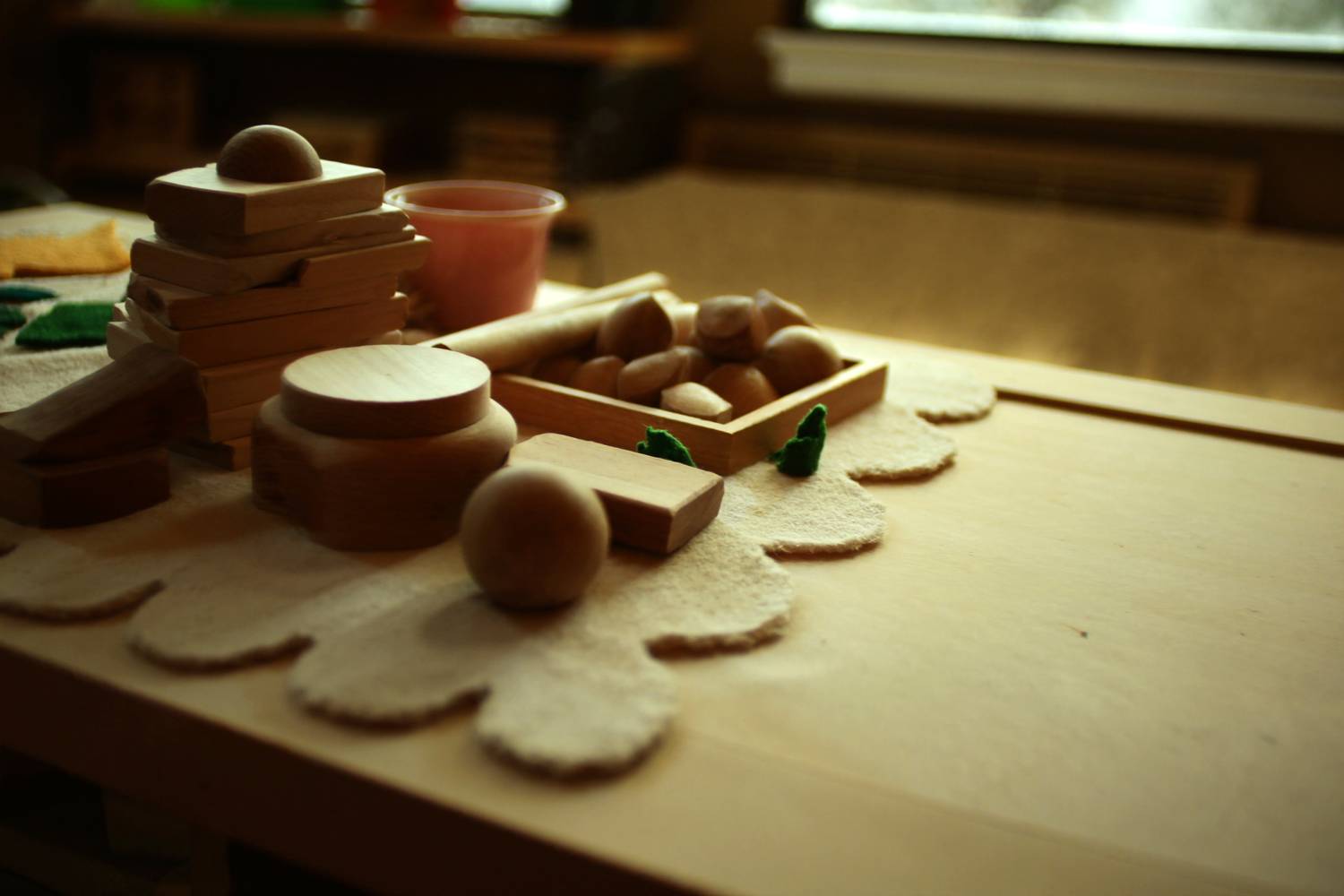 Natural early-learning play materials in warm light