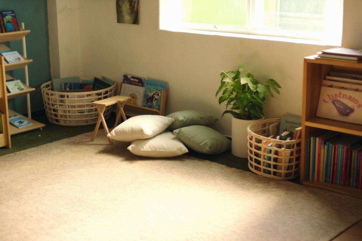 A cosy early-learning reading nook by a window
