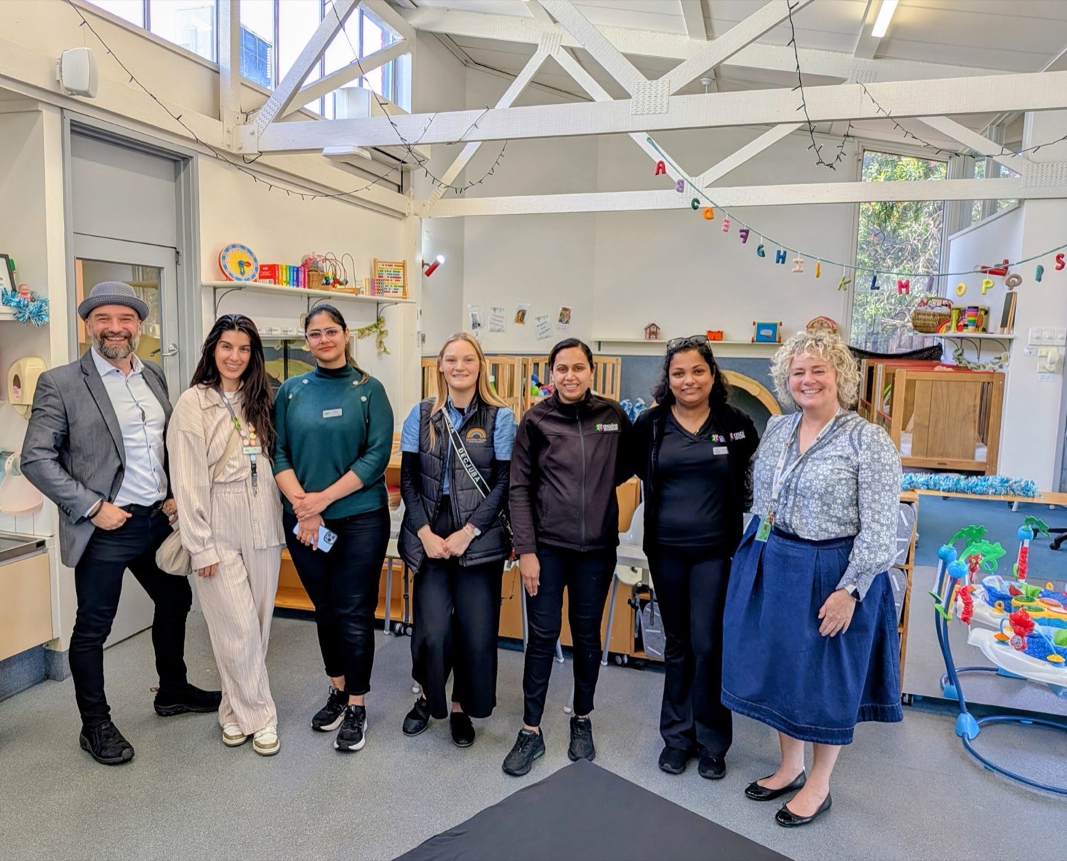 Arek Rainczuk with a group of early childhood educators at a Foundation Learning Centre morning tea