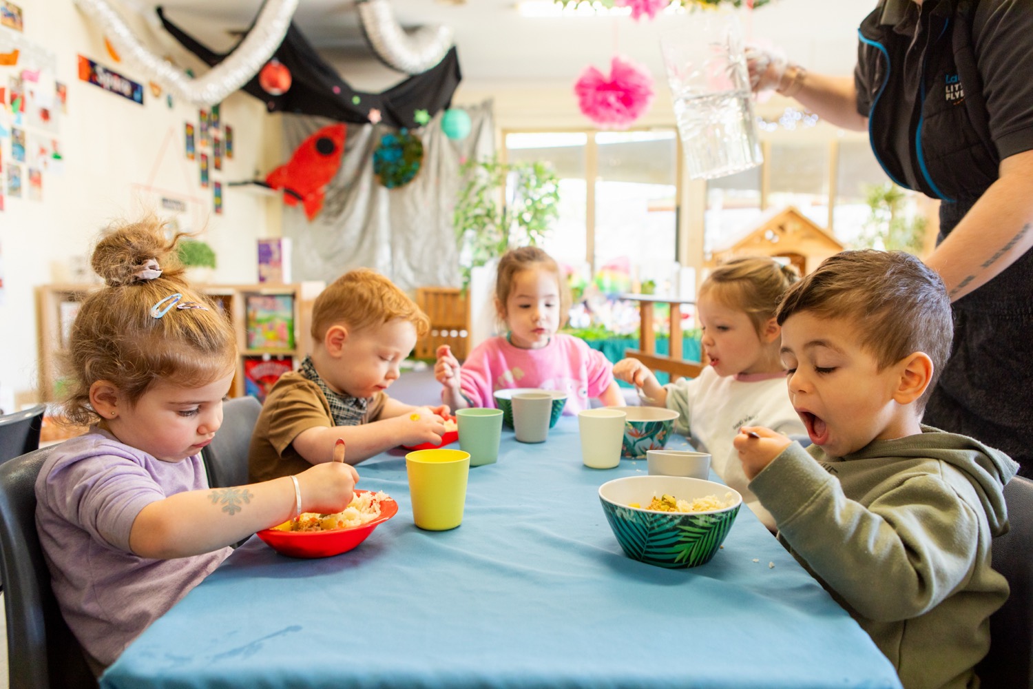 Children sharing a meal together at an early learning centre