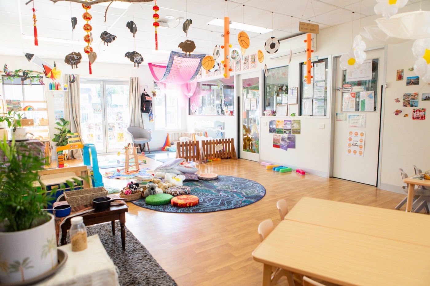 A calm early learning room set with natural play materials