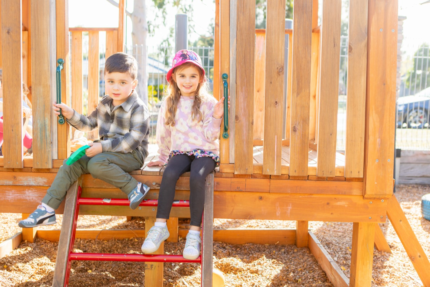 Children playing on outdoor equipment